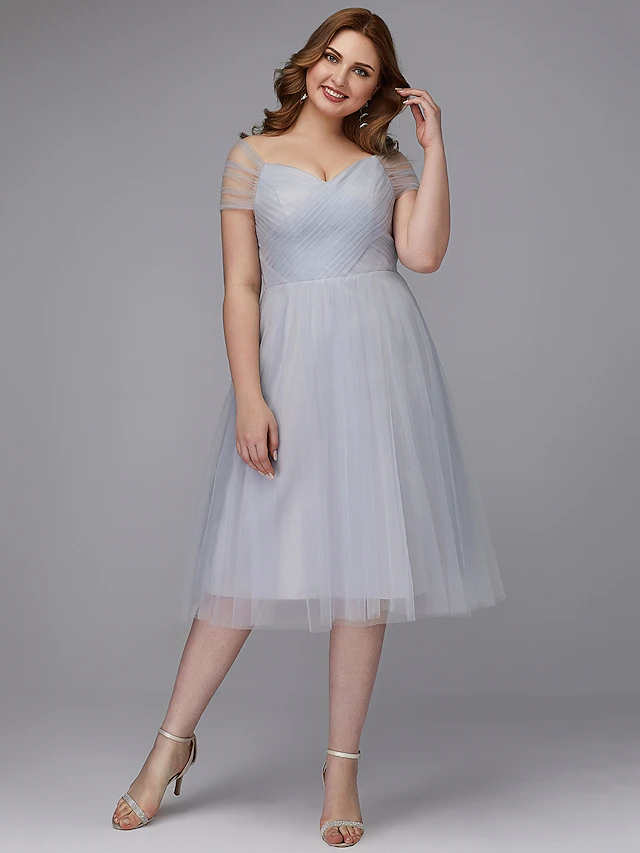 Elegant A-line off-shoulder tea-length tulle dress with sash and criss-cross ribbon.