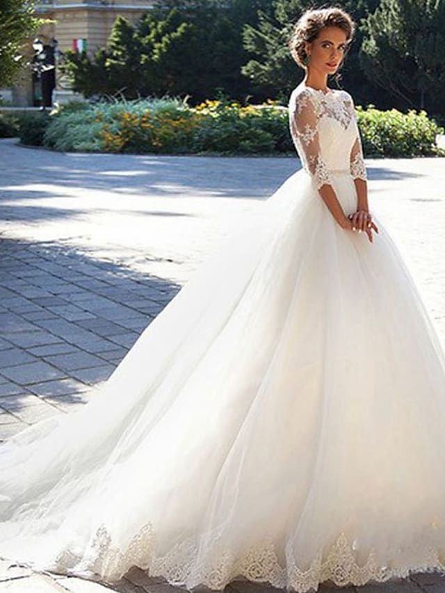 Elegant A-Line off-shoulder wedding dress with lace appliques and court train.