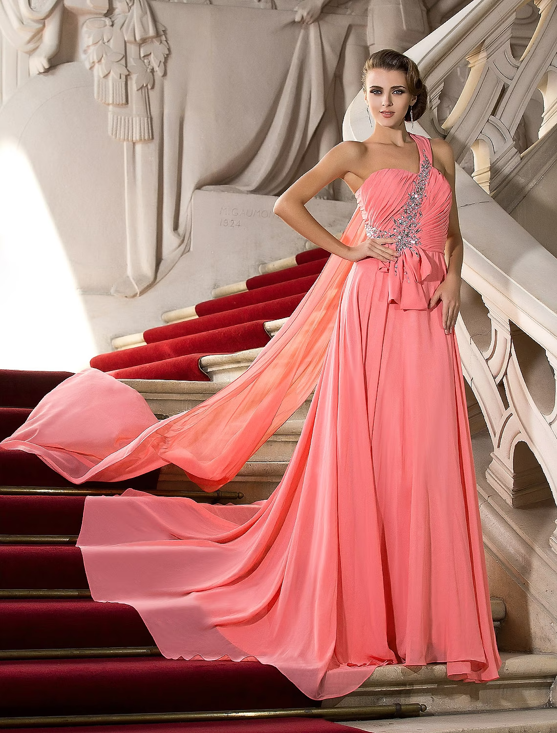 Elegant A-line one-shoulder chiffon gown with crystal embellishments.