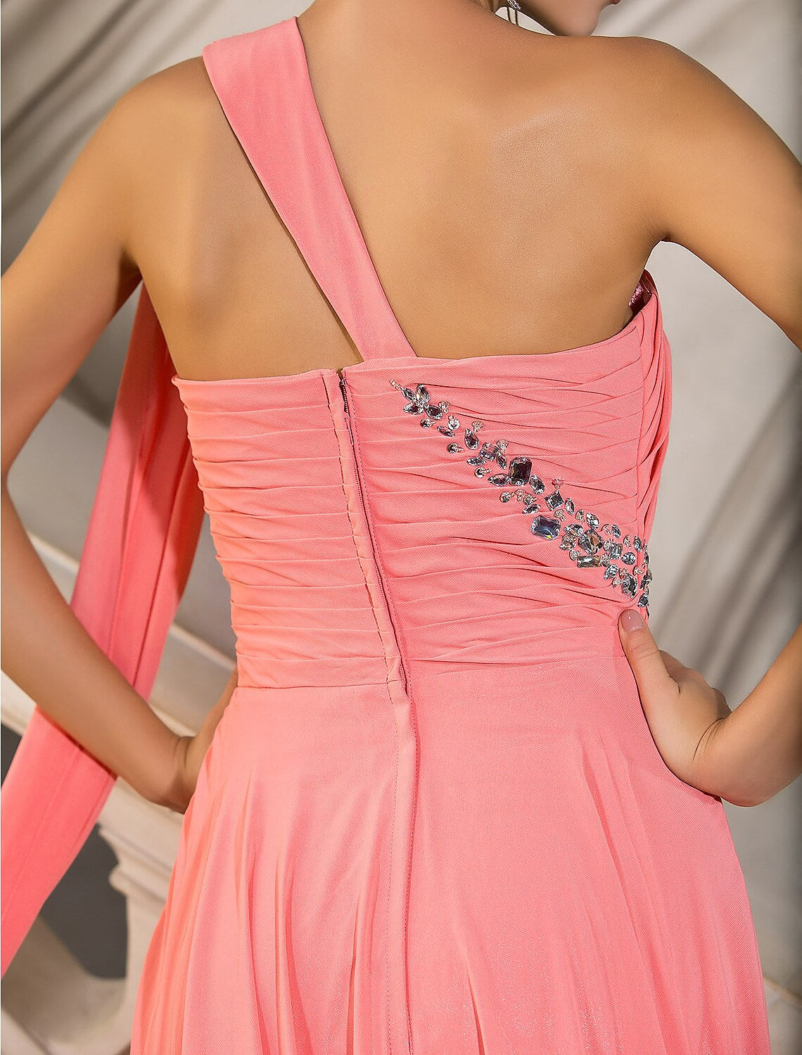 Model wearing the flowing A-line chiffon gown for a formal event.