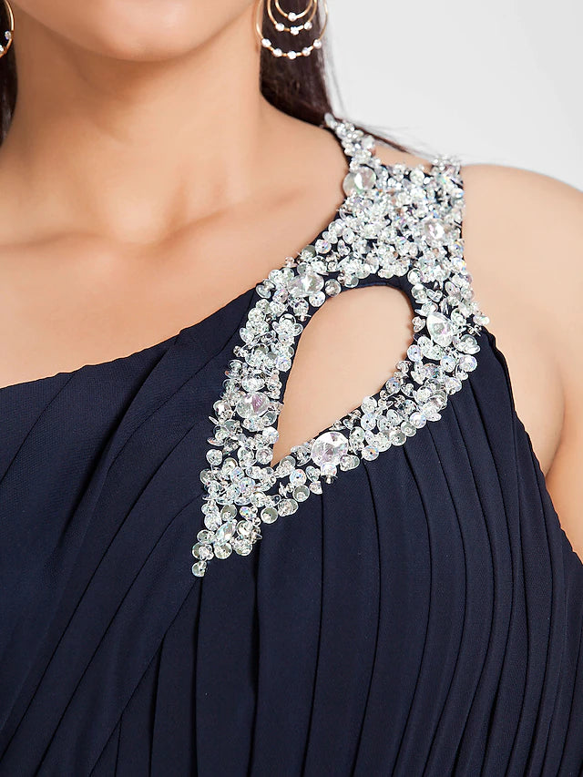 Back view of the one shoulder dress, showcasing the flowing sweep train.
