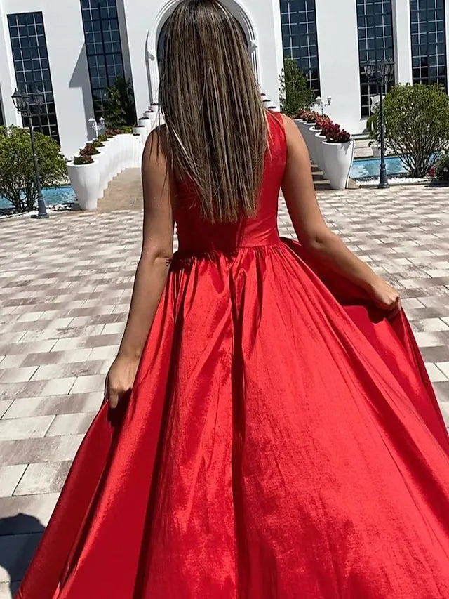 Close-up of the ruched slit and high split on the elegant one-shoulder formal dress.