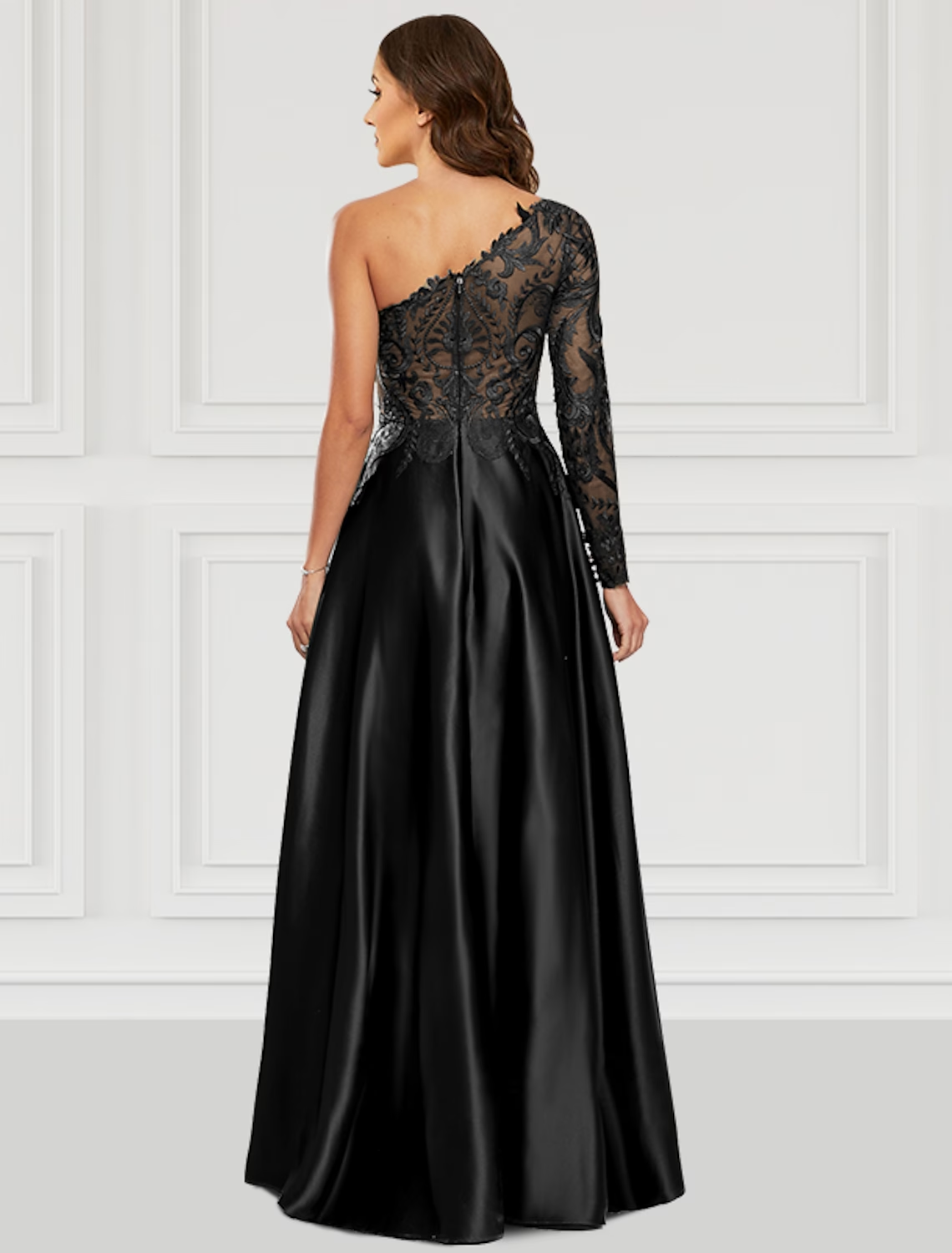 Close-up of the one-shoulder and long sleeve detail on the black satin prom dress.