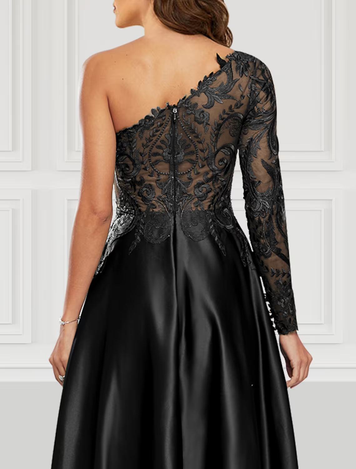 Side view of the black A-line prom gown, highlighting the flowing satin fabric and slit.