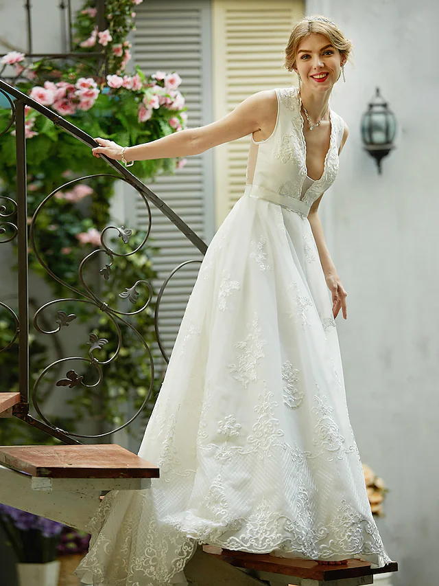Front view of sleeveless A-line wedding dress.