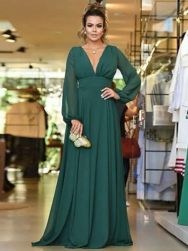 Close-up of the plunging neckline and pleated bodice on the chiffon bridesmaid dress.