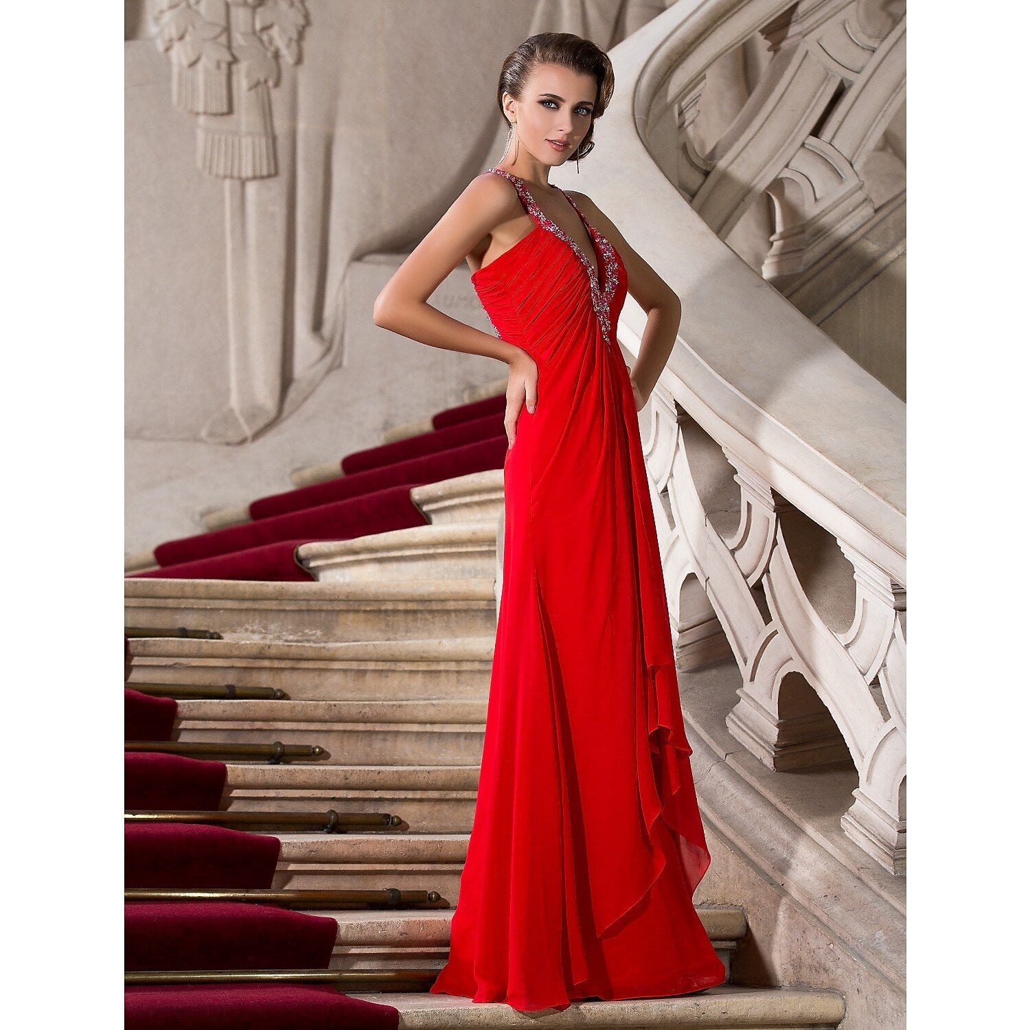 Elegant A-line formal gown with plunging neckline and delicate beading.