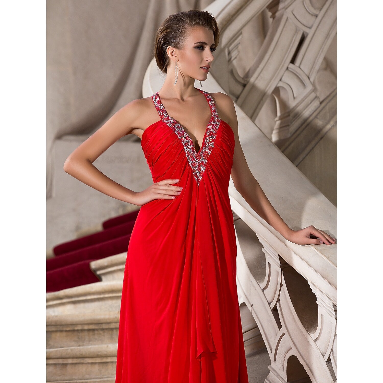 Back view of a sleeveless chiffon evening dress with floor length.