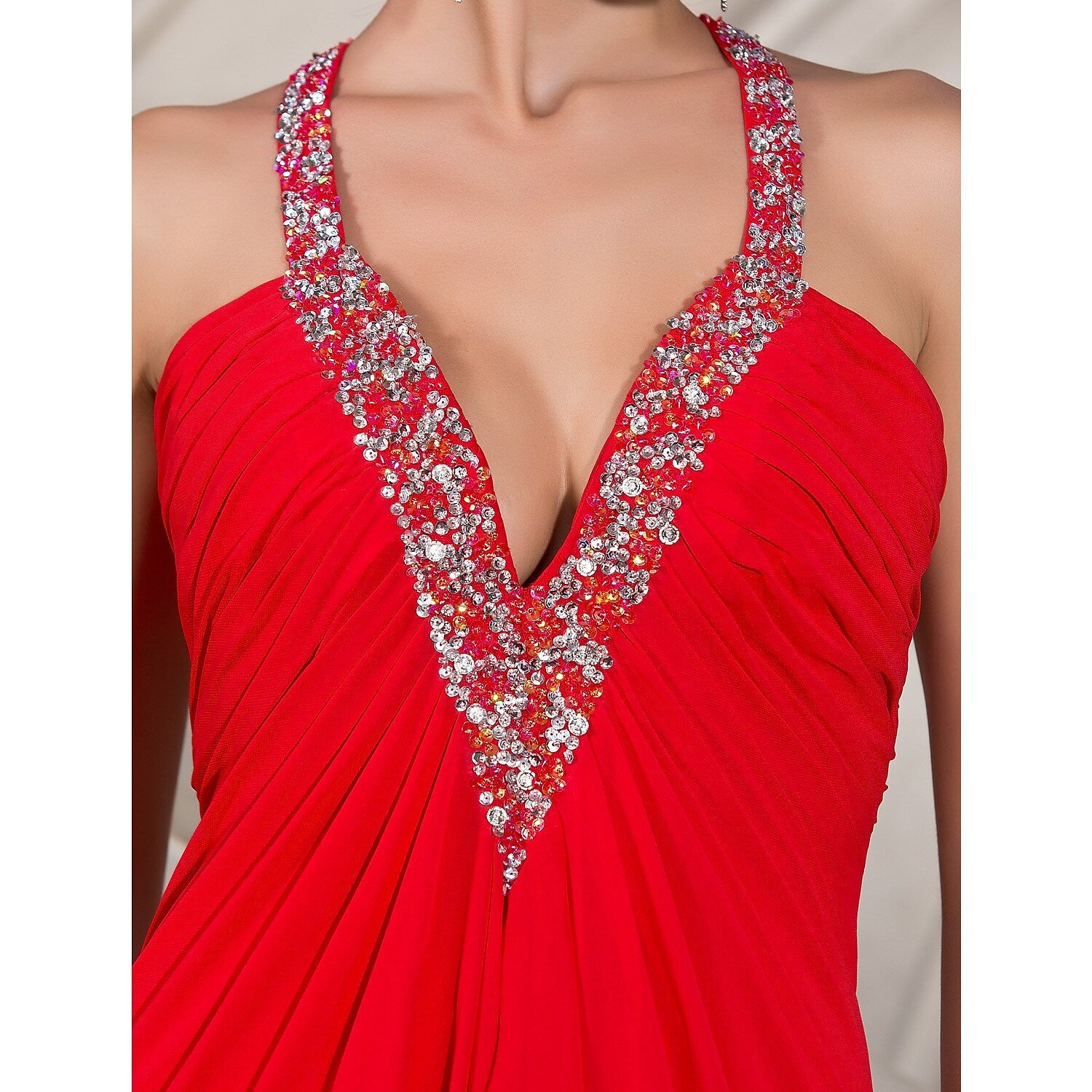 Model posing gracefully in a plunging neck A-line evening dress.