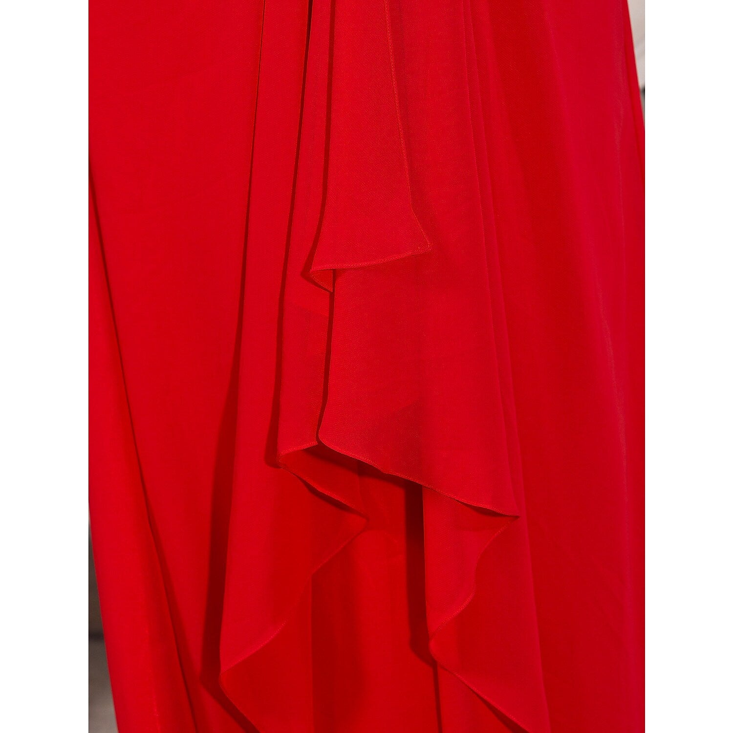 Detail of the chiffon fabric and silhouette of the formal dress.