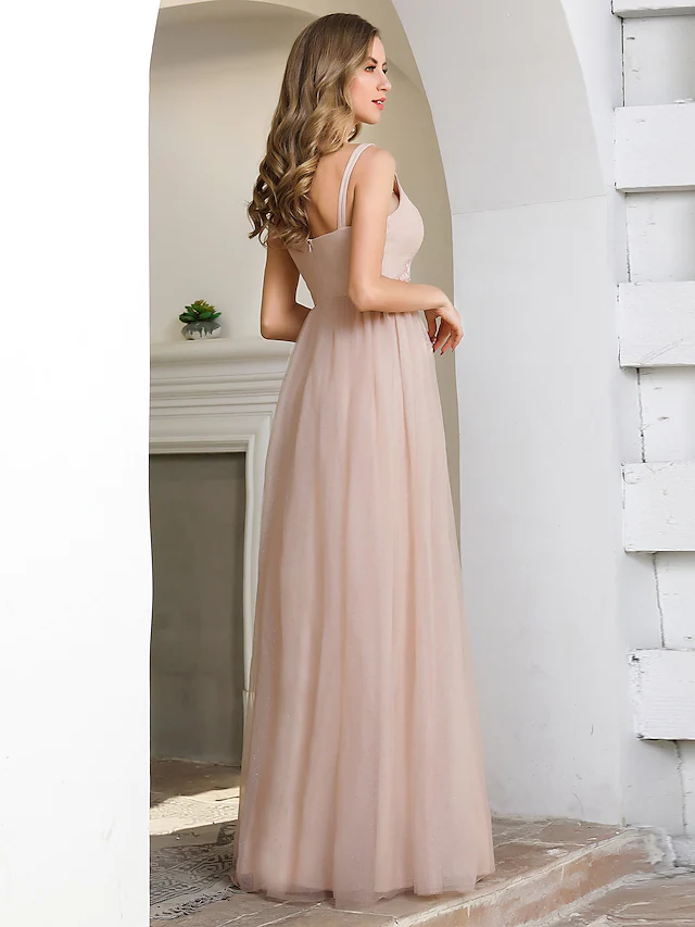 Back view of A-line plunging neck tulle bridesmaid dress.