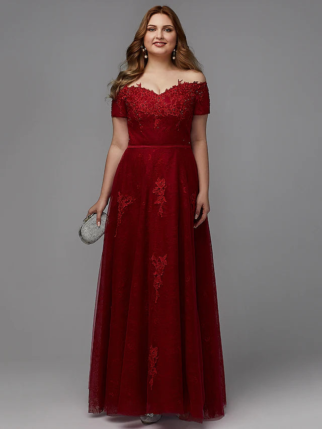 Elegant A-line plus size bridesmaid dress with off-shoulder neckline and lace details.