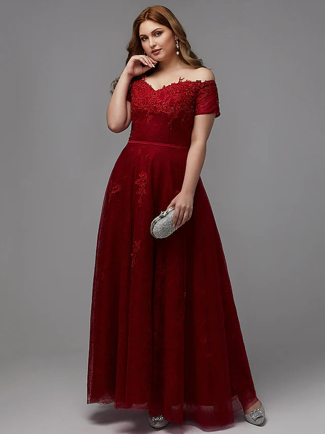 Side profile of a plus size off-shoulder lace bridesmaid dress.