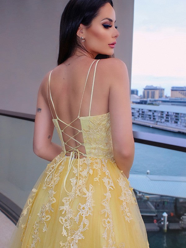 Back view of the floor-length tulle prom dress with delicate straps.