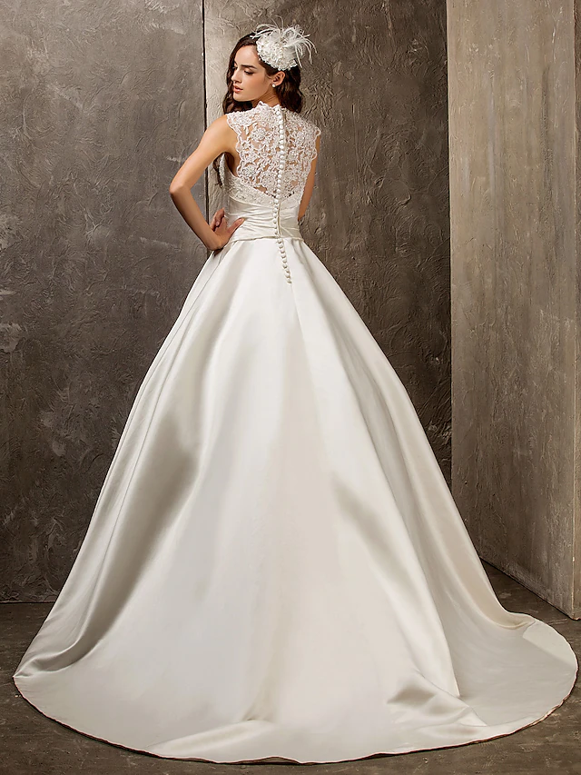 Full length view of an A-Line bridal gown with intricate beading.