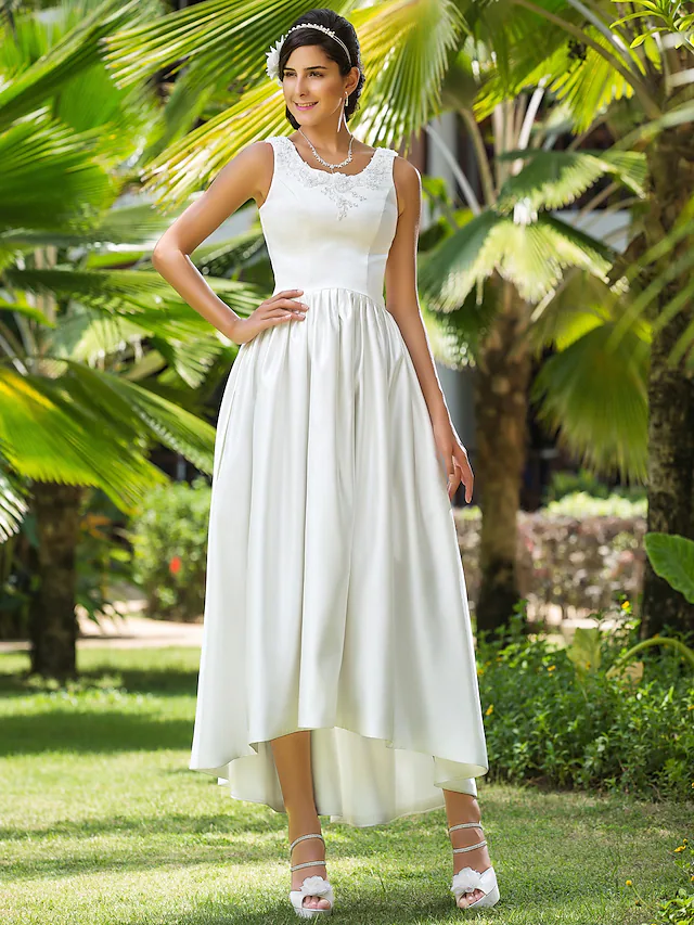 Princess A-Line wedding dress with scoop neck and asymmetrical satin skirt, featuring beading and appliques.