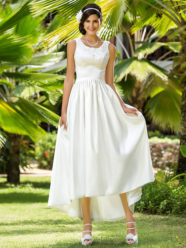 Back view of the A-Line satin wedding dress, showcasing the elegant train and beading details.
