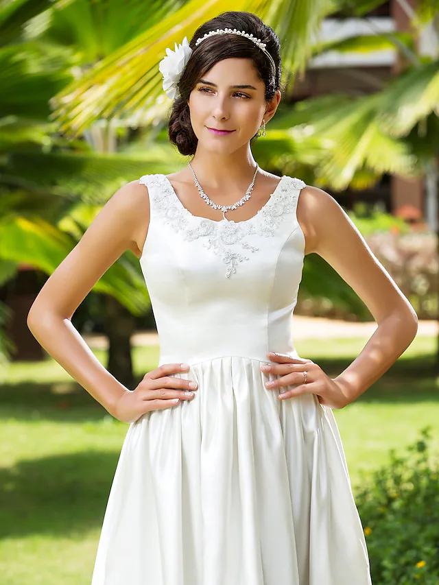 Full length view of the A-Line wedding dress, emphasizing the flowing satin skirt and scoop neckline.