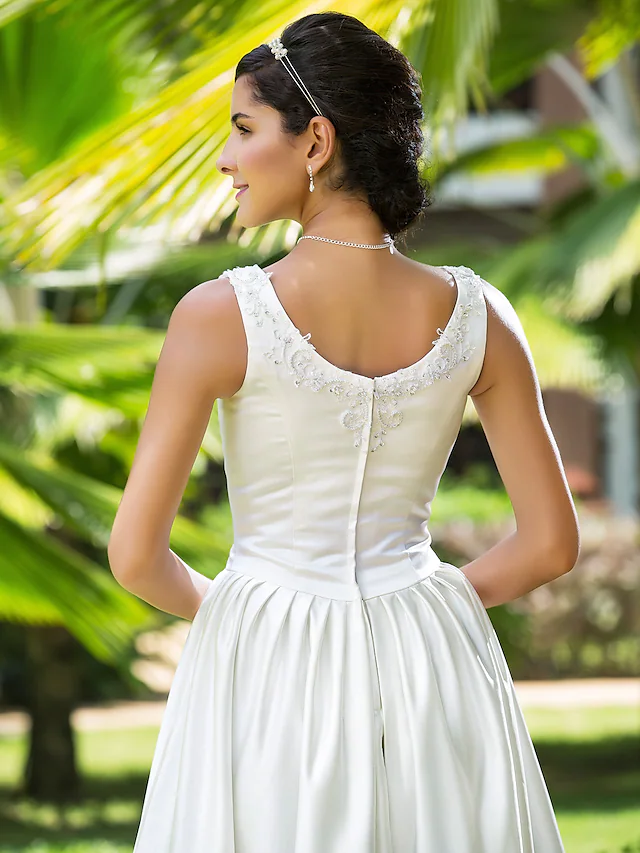 Detail of the satin fabric and beading on the Princess A-Line wedding dress.