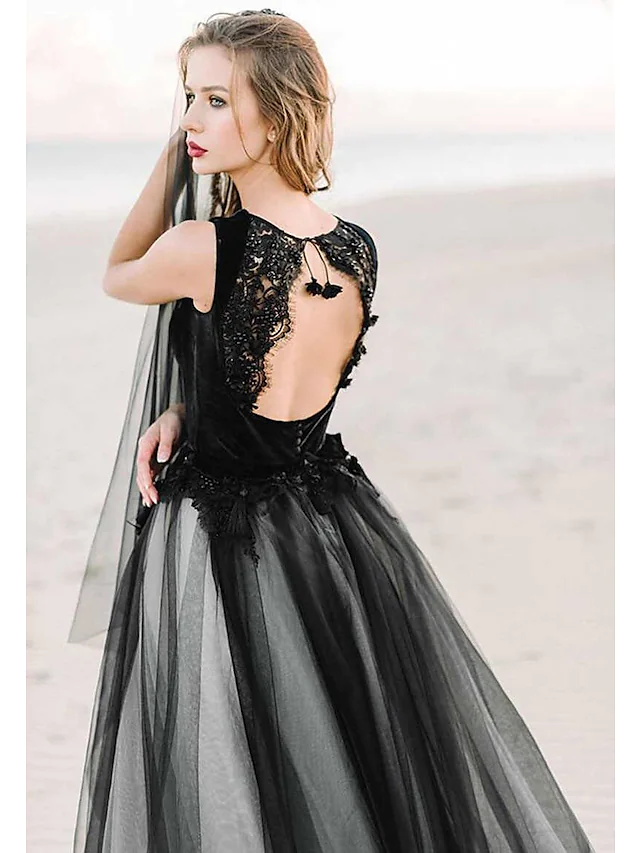 Side view of black A-Line wedding dress, highlighting the silhouette and appliques.