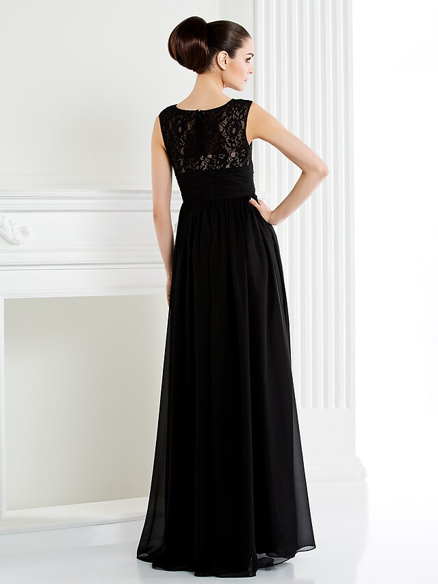 Back view of a floor-length chiffon and lace gown.