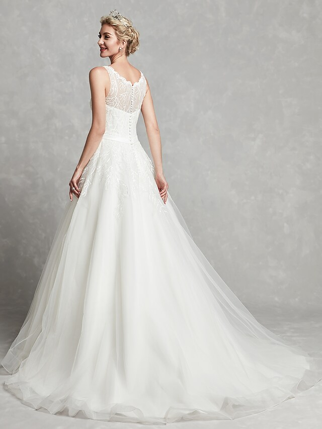 Close-up of the lace bodice and scoop neck on the A-line wedding dress.