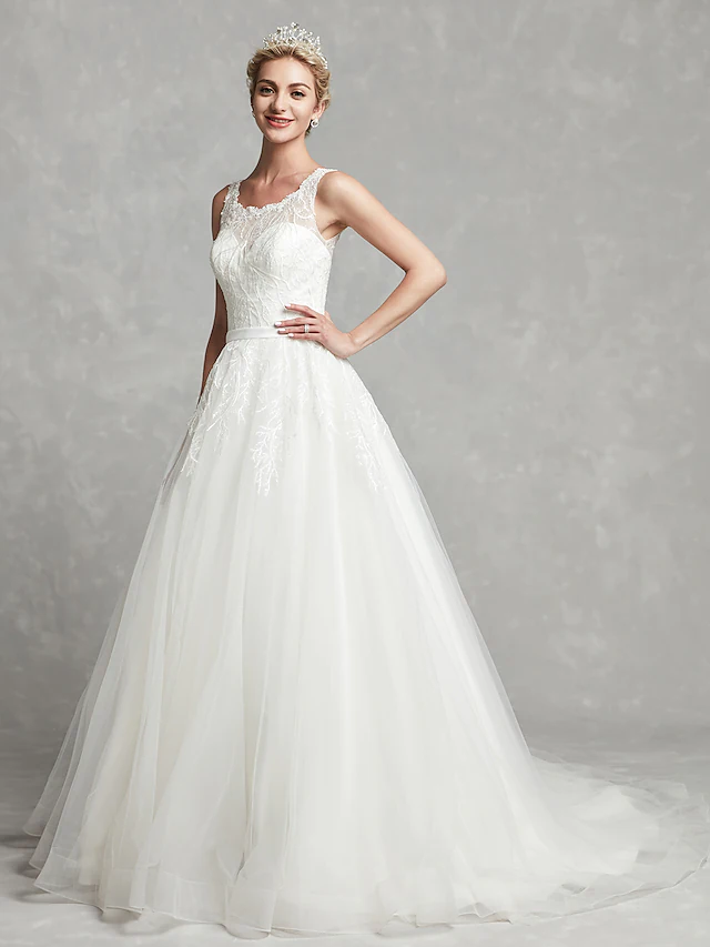 Back view of the A-line wedding dress featuring illusion detail and lace sash.