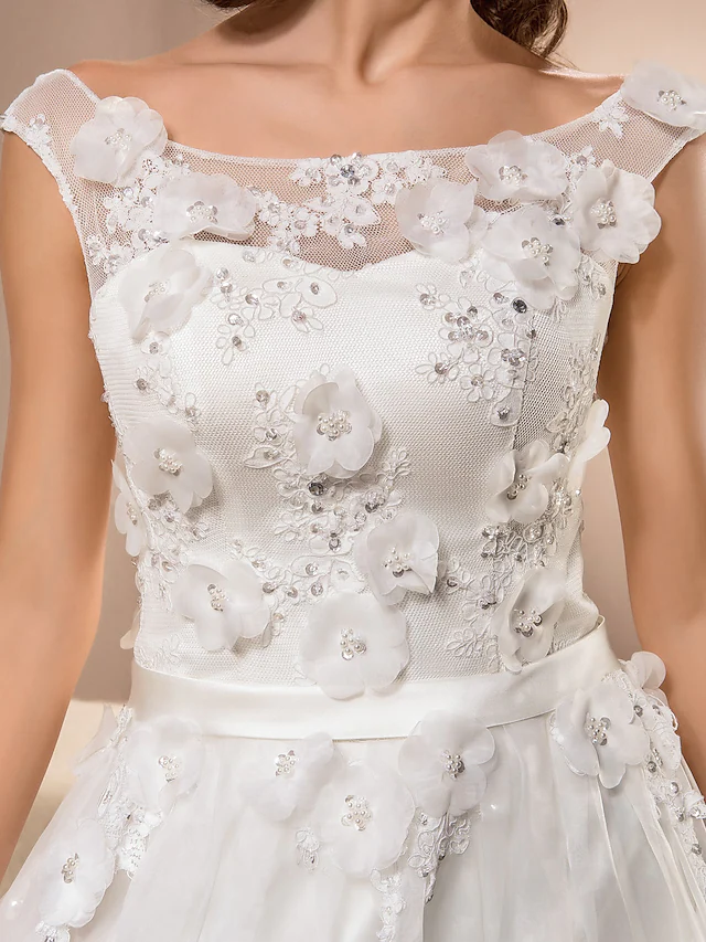 Full length view of the A-line wedding dress with sash and ribbon details.