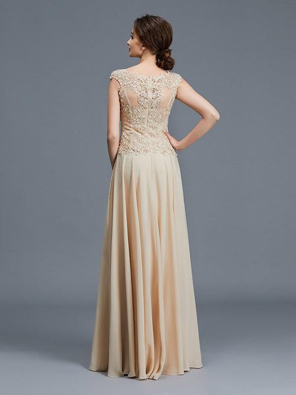 Floor-length chiffon Mother of the Bride dress with flowing silhouette.