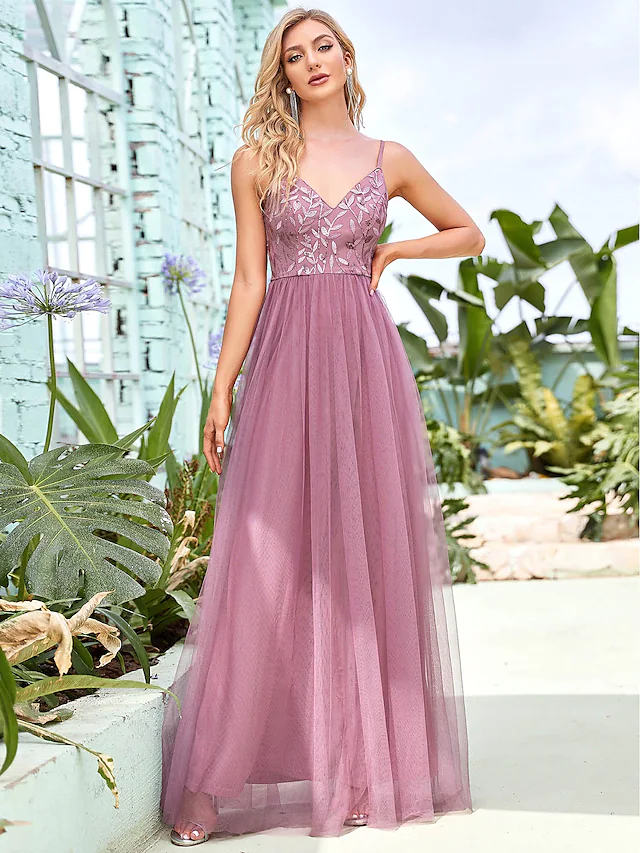 Elegant A-line sequined tulle bridesmaid dress with spaghetti straps.