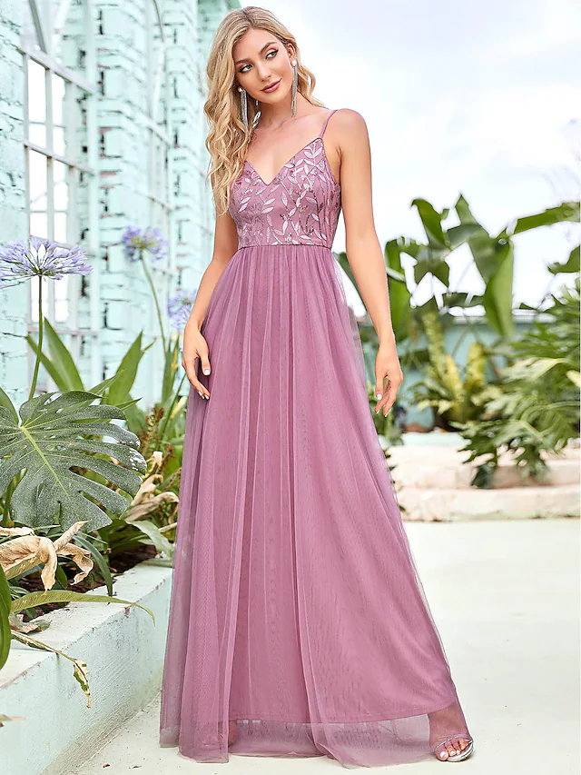 Back view of floor-length tiered bridesmaid gown.