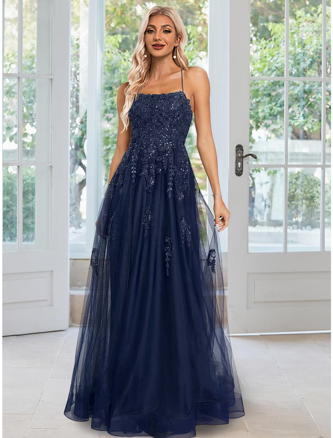 Elegant A-Line sheath evening gown with floral sequin appliques.