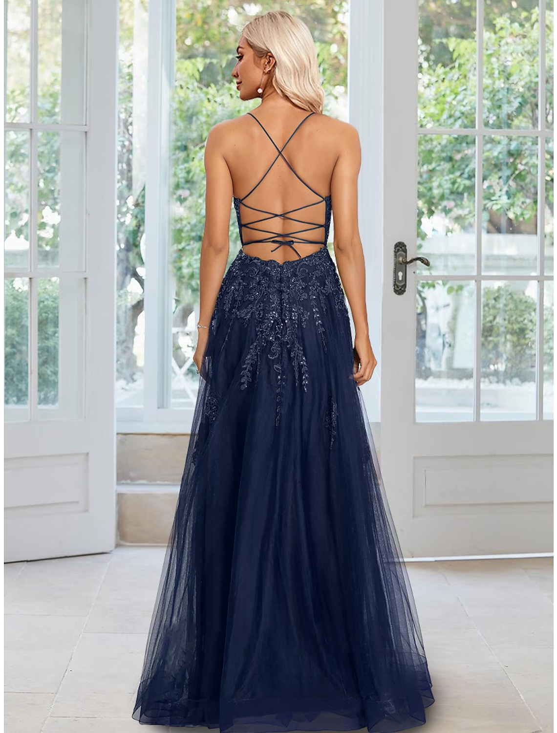Side profile of the spaghetti strap A-Line formal gown.