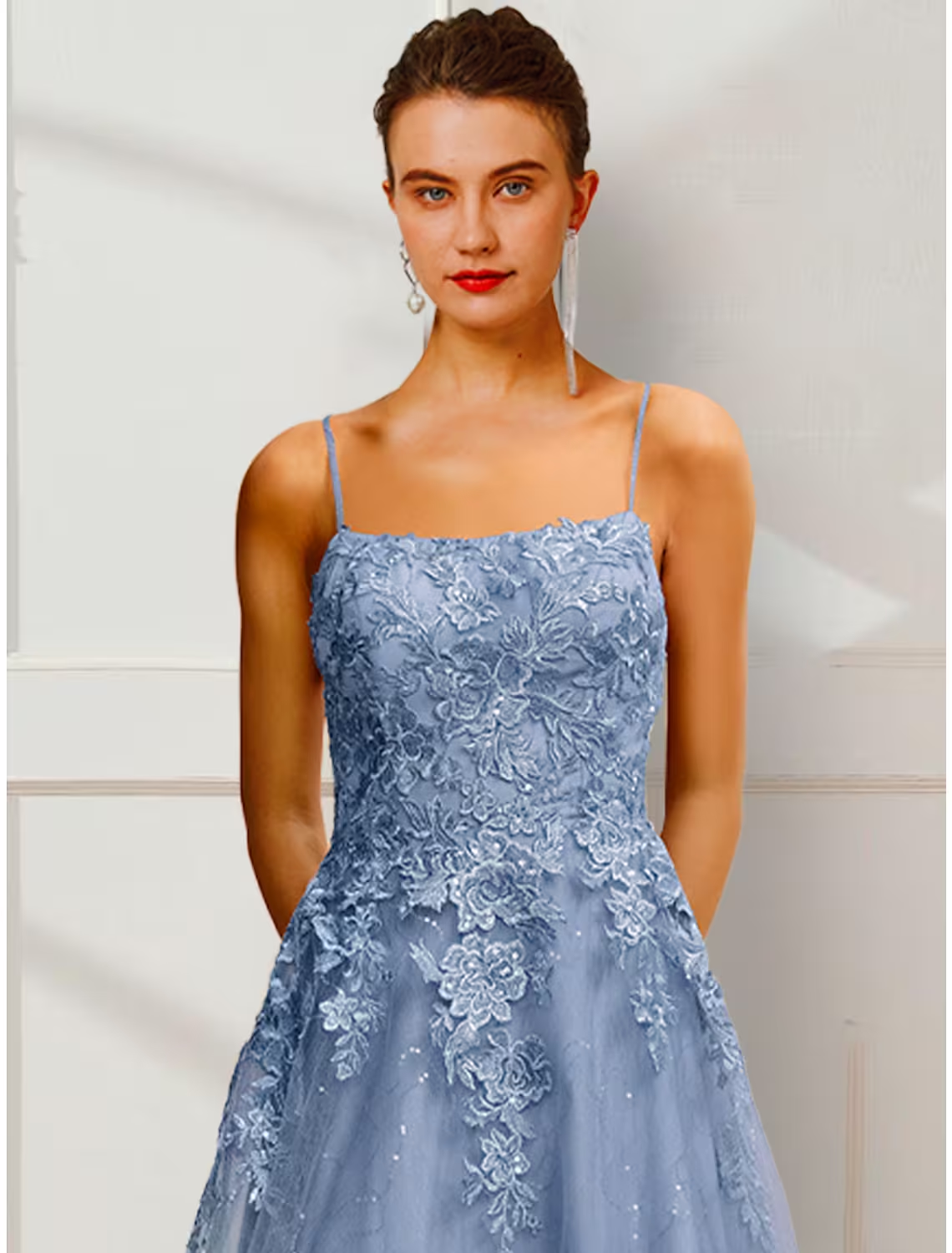 Back view of A-line satin prom dress with delicate floral details.