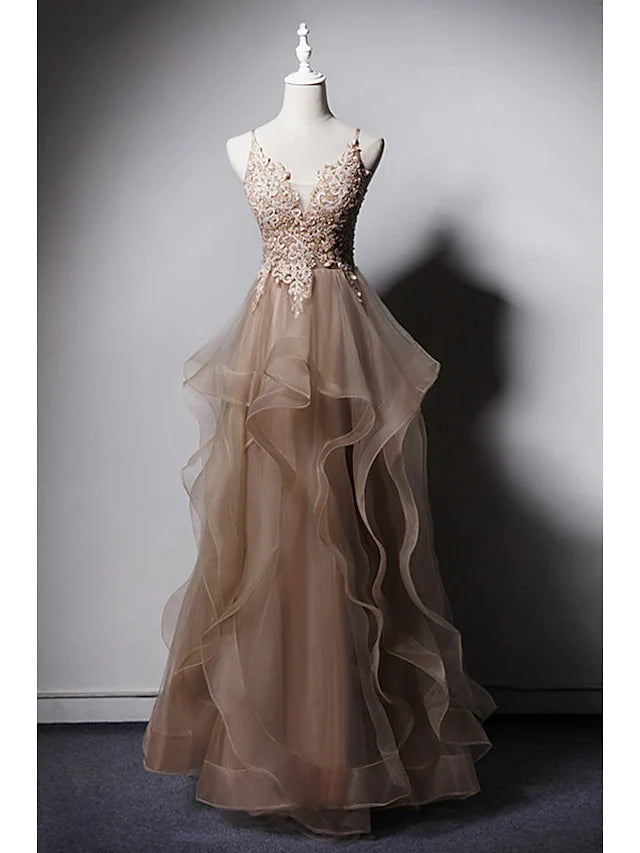 Elegant A-line prom dress with spaghetti straps and lace details.