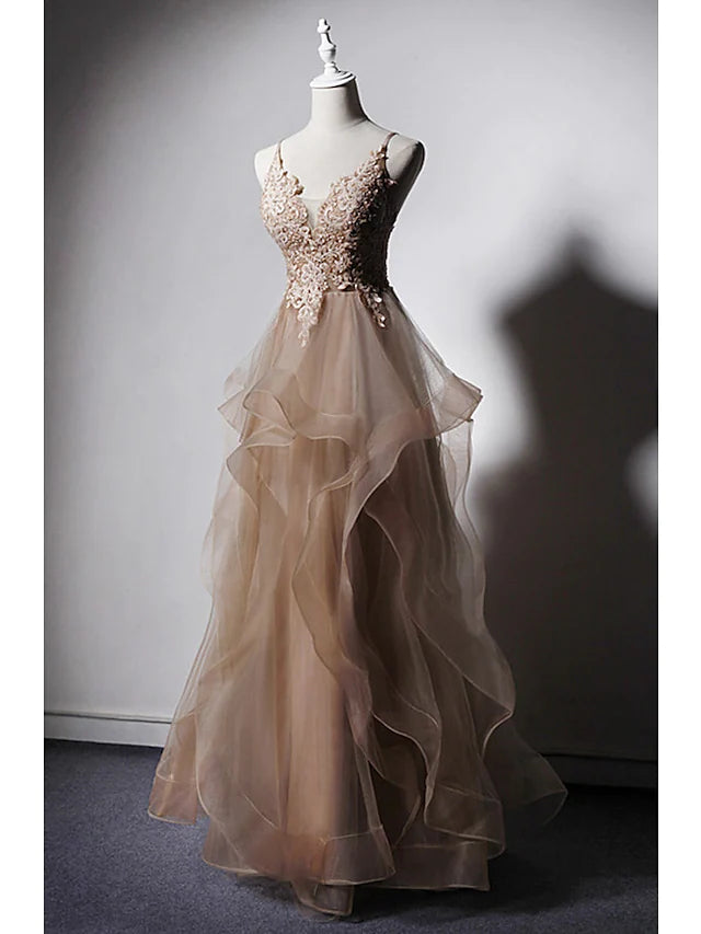 Close-up of delicate lace, ruffles, and appliques on the prom dress.