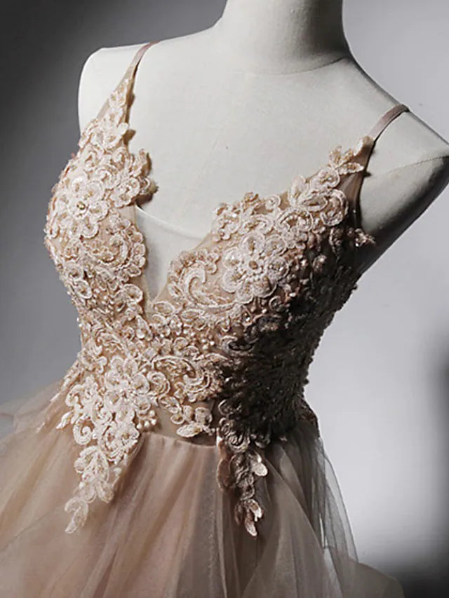 Side profile of the A-line spaghetti strap prom dress.