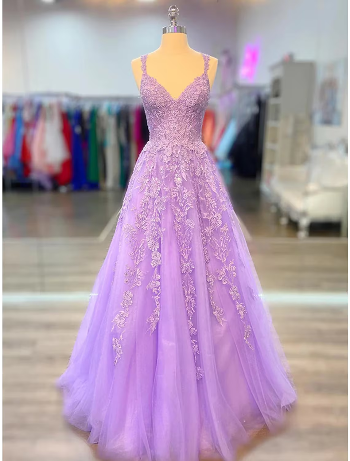 Elegant A-line maxi prom dress with spaghetti straps and appliques.