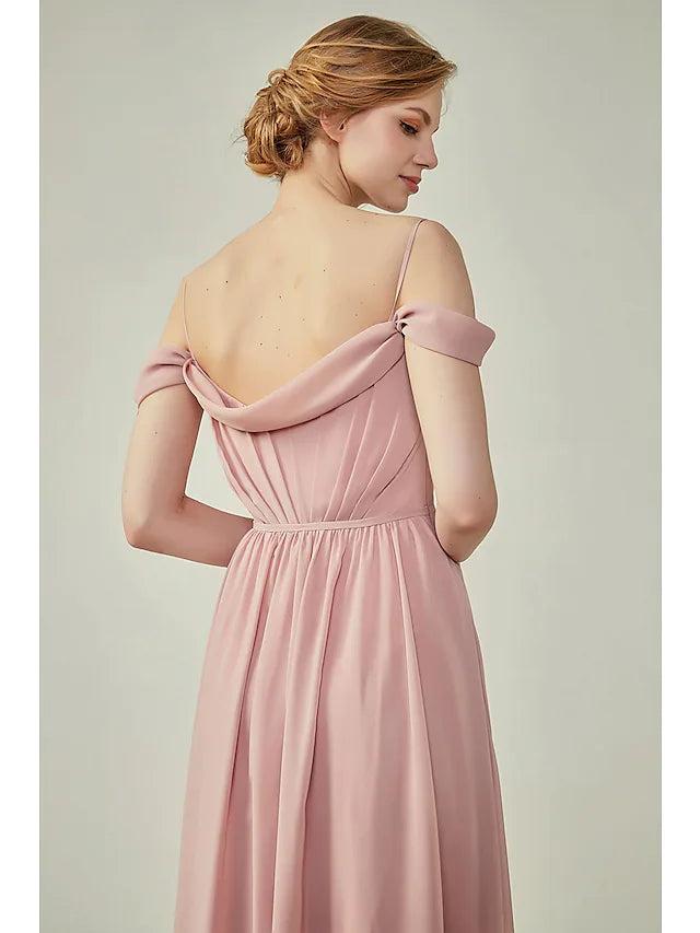 Side view of a woman in a ruched A-line chiffon bridesmaid dress with a subtle slit.