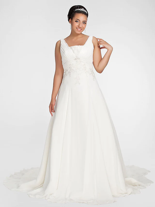 Close-up of the square neckline and intricate beading on the wedding dress.