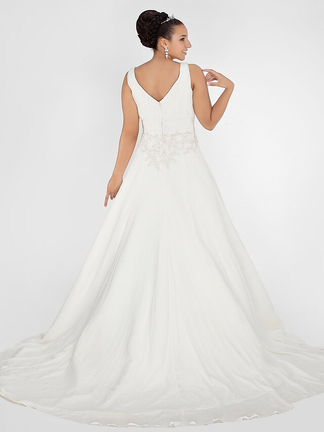 Detail of the appliques and chiffon fabric on the sleeveless wedding gown.