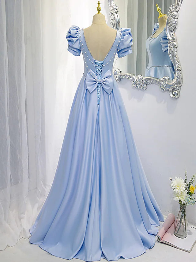 Back view of the satin A-Line bridesmaid dress with bow detail.