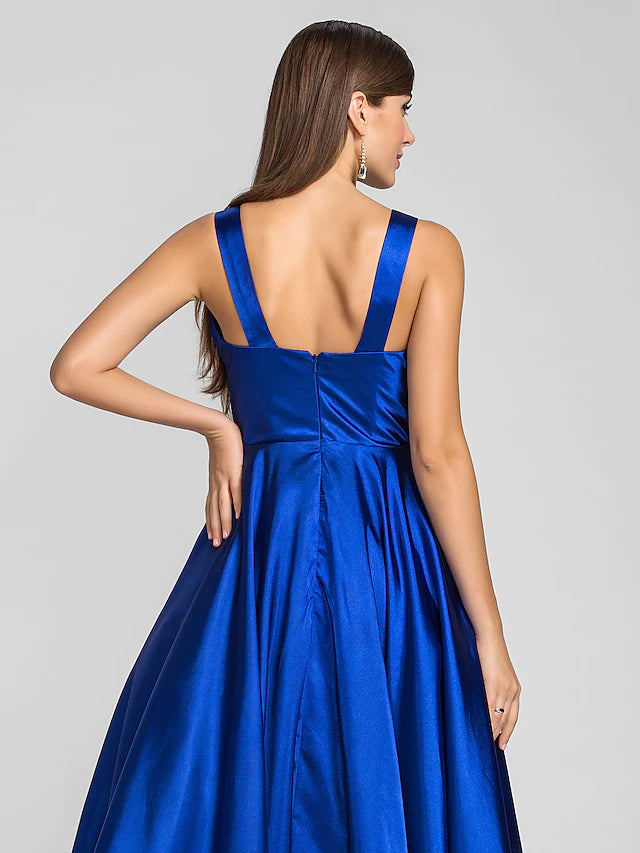 Close-up of the square neckline and stretch satin fabric of the dress.
