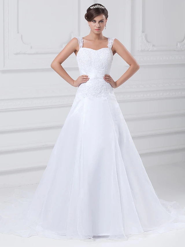 Elegant A-Line wedding dress with square neck and lace appliques.