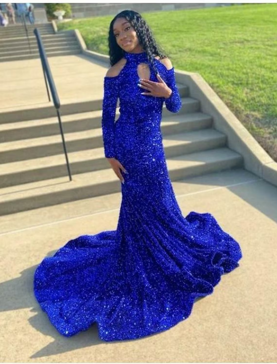 Model wearing an elegant A-line strapless floral lace prom dress with appliques.