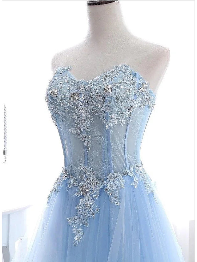 Side view of the elegant strapless gown, highlighting the floral lace and delicate pleats.