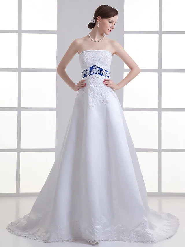 A-Line strapless wedding dress with lace appliques and a court train.
