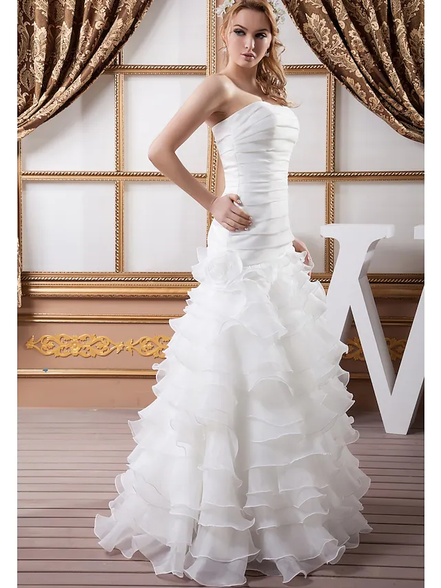 Back view of A-Line wedding dress showing floor-length skirt and train.