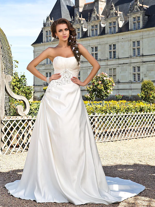 Elegant A-line strapless satin wedding dress with chapel train.