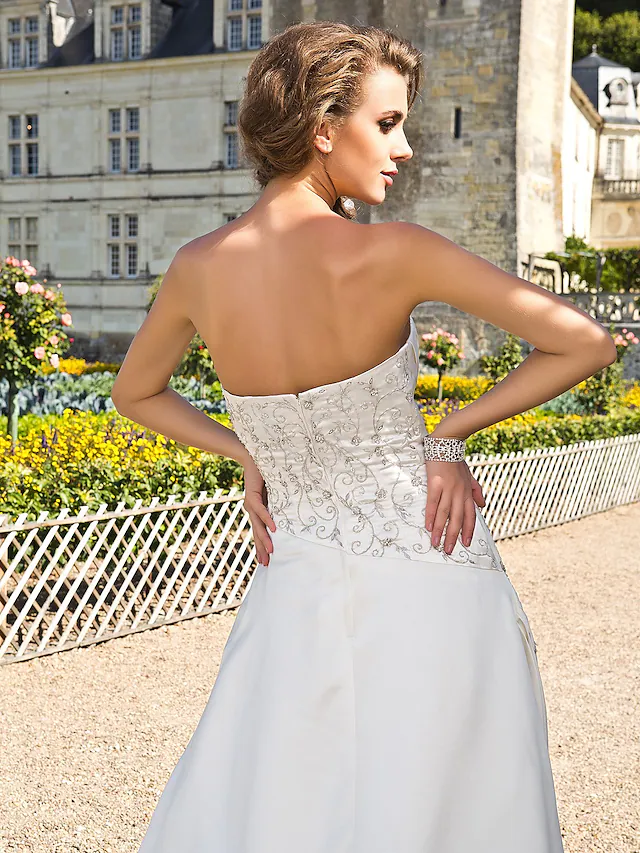 Elegant A-line strapless satin wedding dress with chapel train.